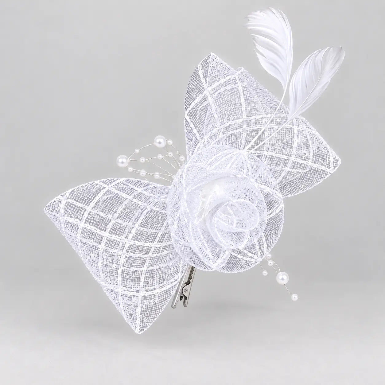 Bella white bridal flower fascinator hair clip worn with softly curled hair