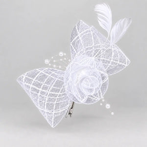 Bella white bridal flower fascinator hair clip worn with softly curled hair