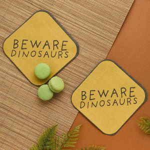 Dinosaur party lunch napkins with Beware Dinosaurs sign design