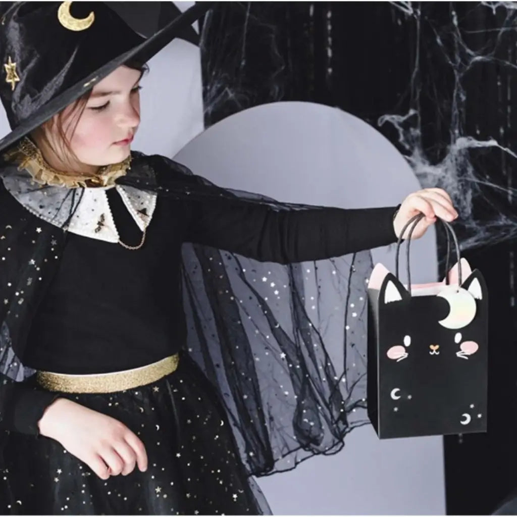Celestial Halloween treat bag with stars, moons and pink details