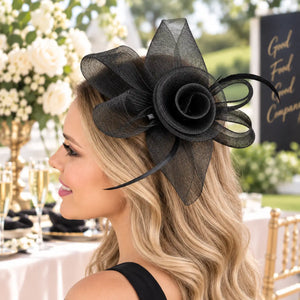 Black Derby Day fascinator clip with translucent loops and a mesh rose