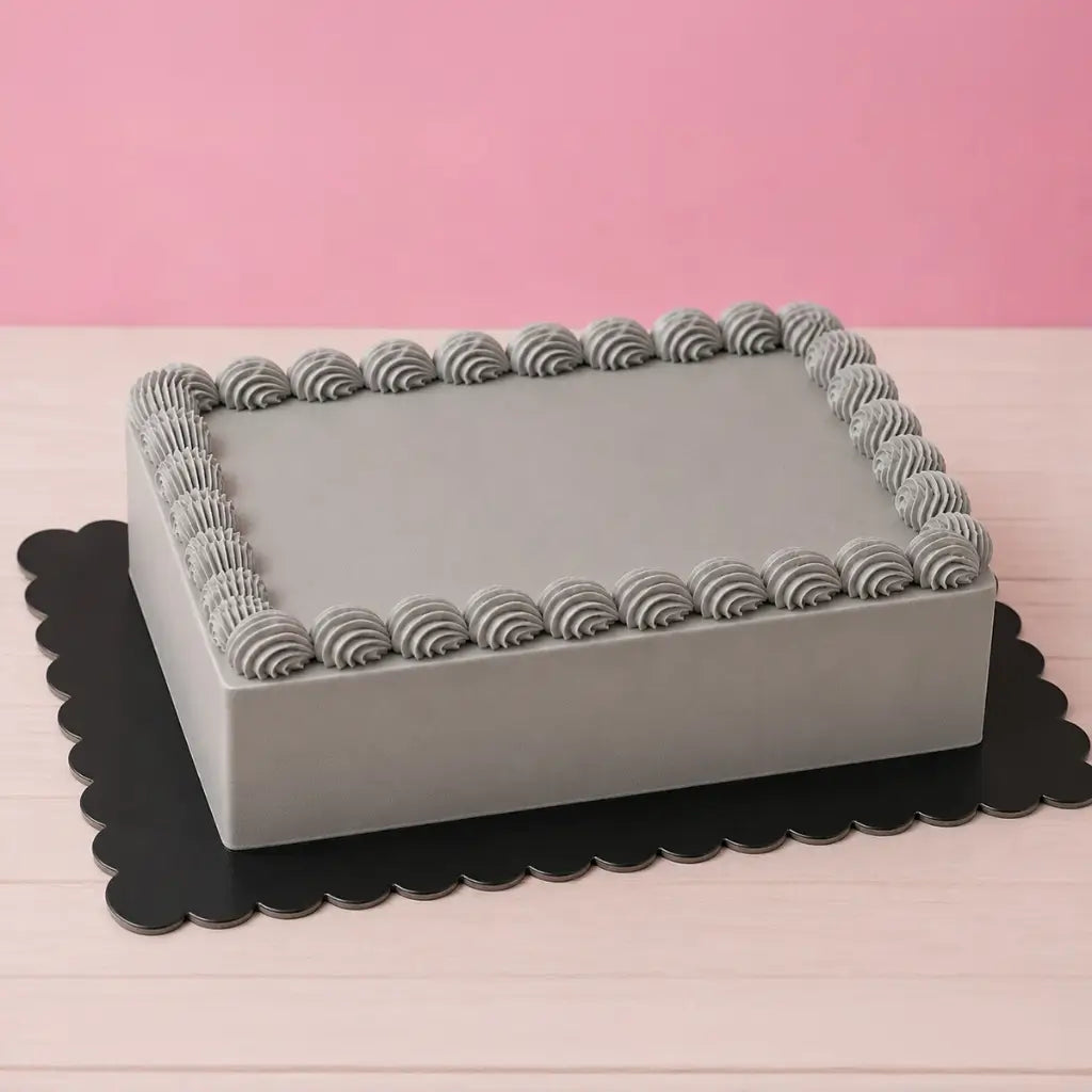 Black rectangular scalloped cake board for dramatic cake displays