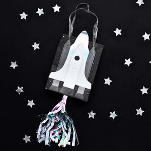 Kids’ astronaut party bags with iridescent flames