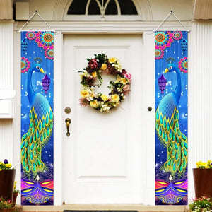 Decorative peacock banners on a door with a floral wreath.