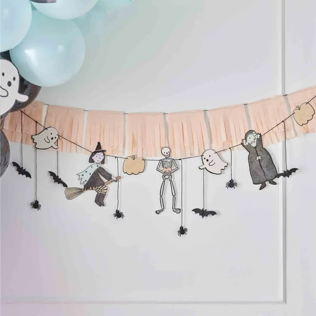 Boo Crew Halloween character bunting with peach tassel fringe garland