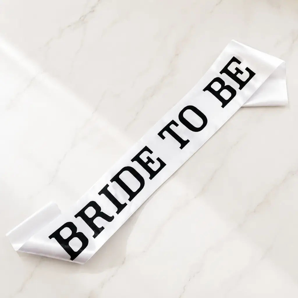 White 'BRIDE TO BE' Sash with Black Print – Elegant Hen Party &amp; Bridal Shower Accessory