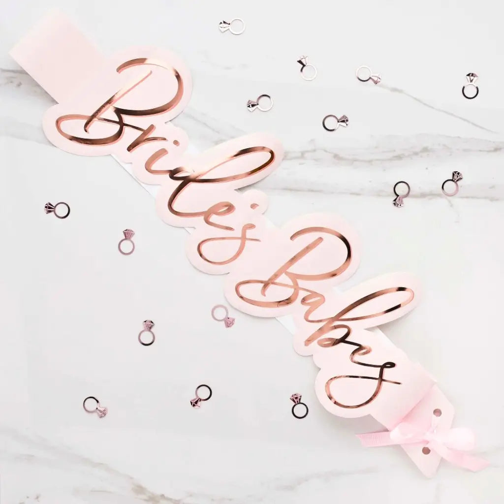 She Said Yaaas Brides Babes blush pink paper sashes with rose-gold foil text