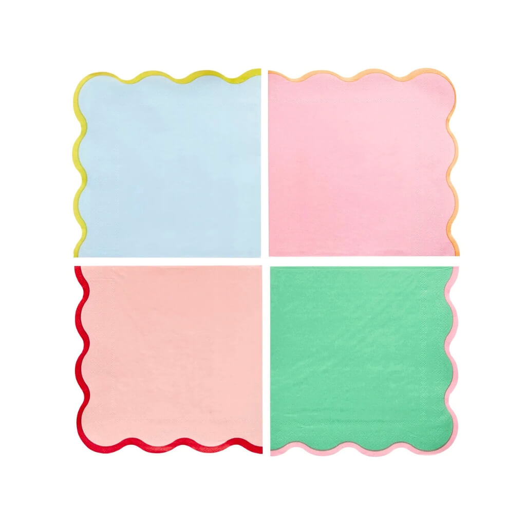 Colourful scalloped napkins for rainbow birthday party theme