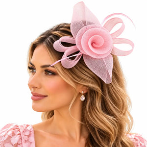 Blush pink flower fascinator with airy loops for race-day styling