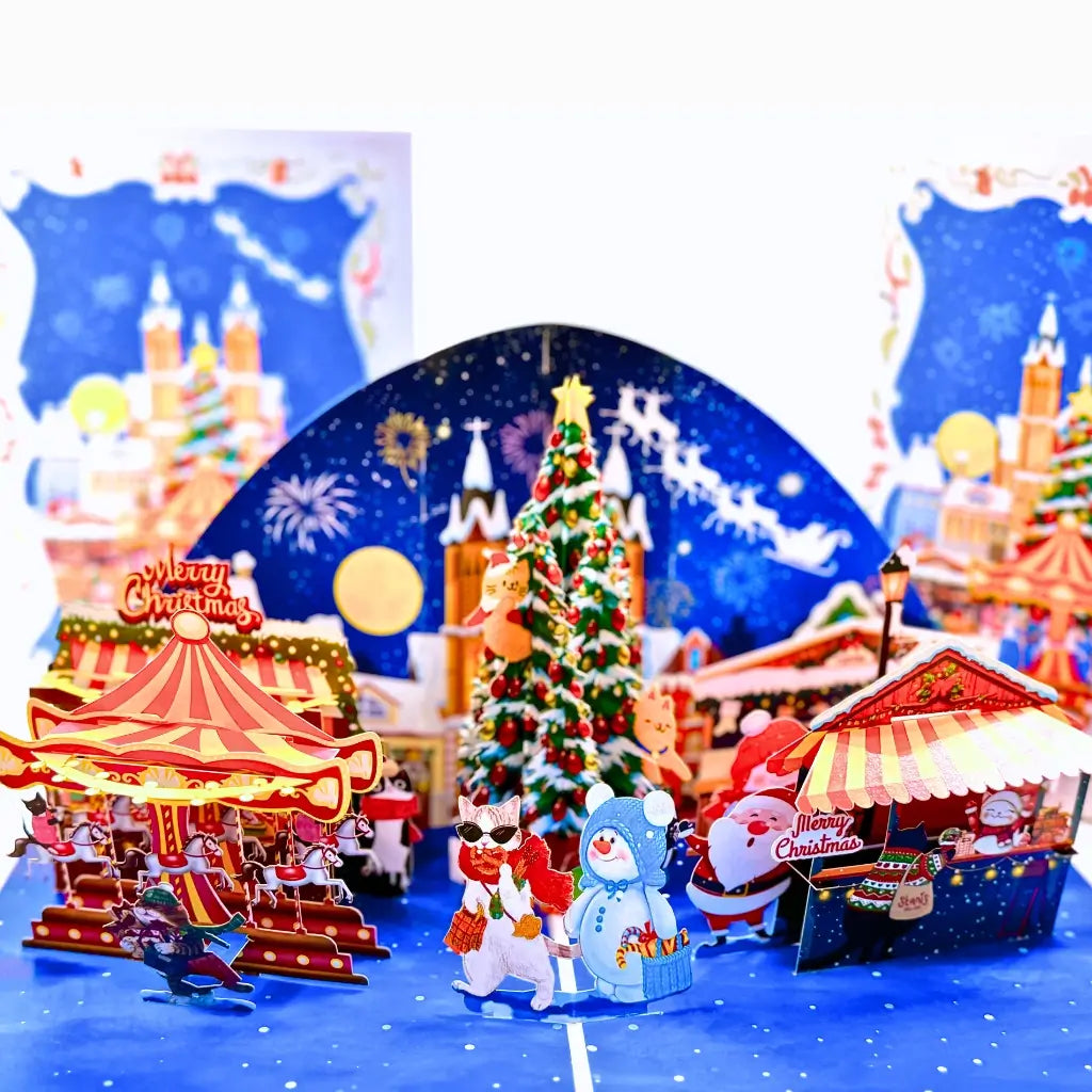 Whimsical 3D snowy village card with cats enjoying holiday fun