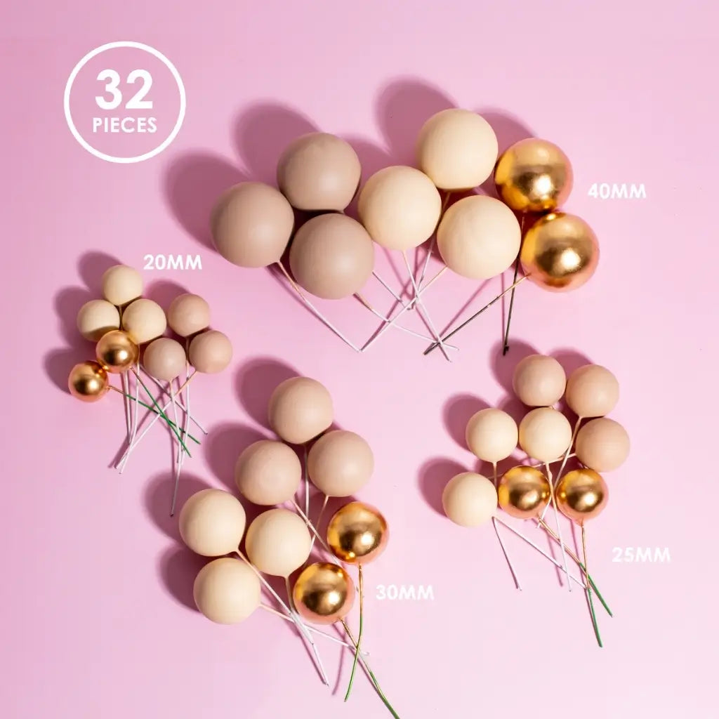 champagne gold cake ball toppers set on cake