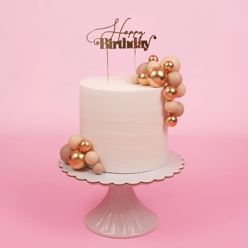 balloon style cake topper champagne gold balls on cake