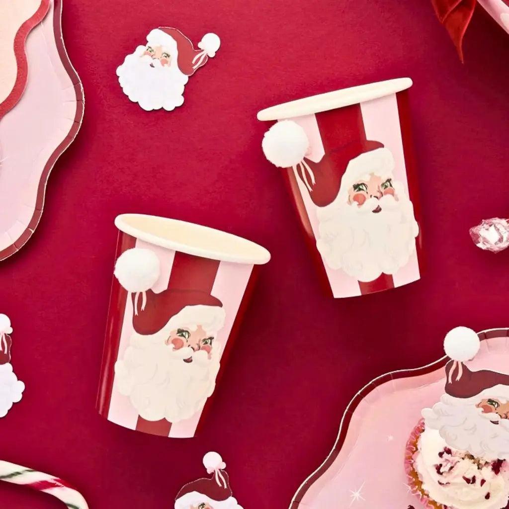 266ml Santa Baby paper cups with retro Santa design for festive drink serving