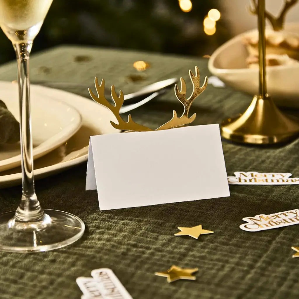 Cosy Christmas white folded place cards with gold foil antler design