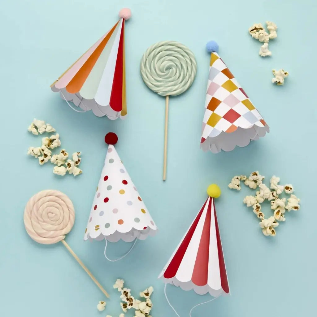 Circus party hats with pom poms colourful design