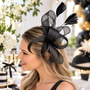 Black race-day fascinator featuring upright feather sprays
