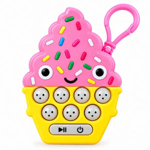 Pink cupcake quick reaction button game with seven illuminated buttons