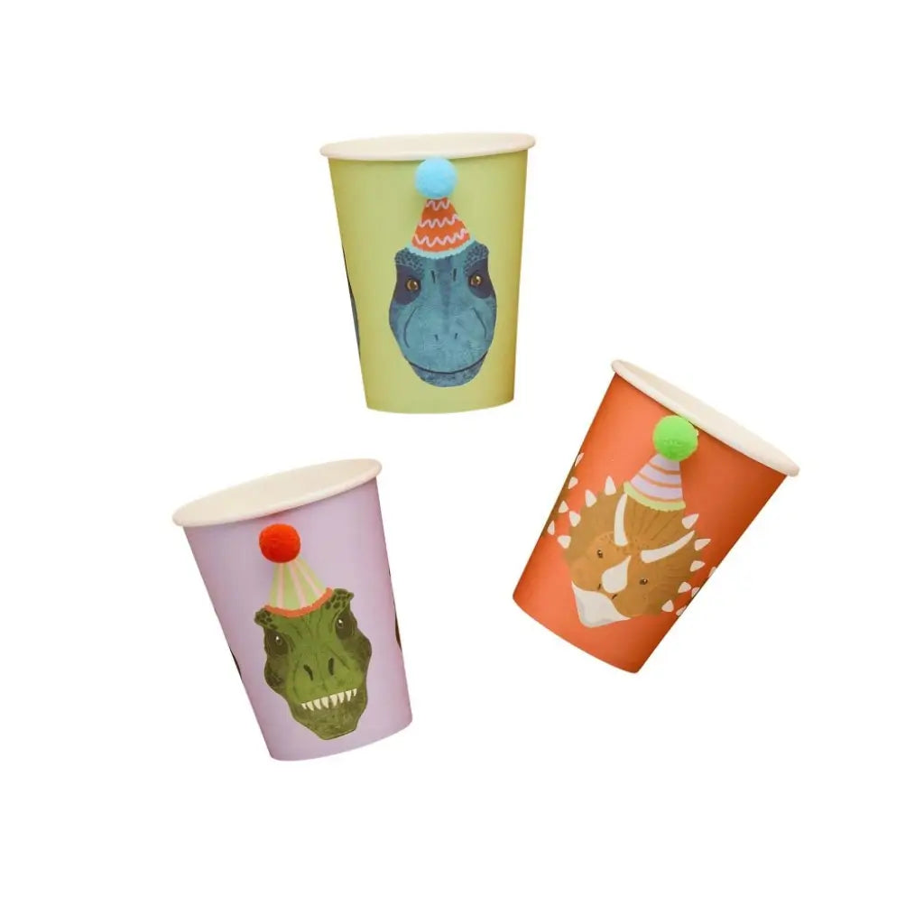 Dinosaur-themed paper drink cups with pom pom decorations