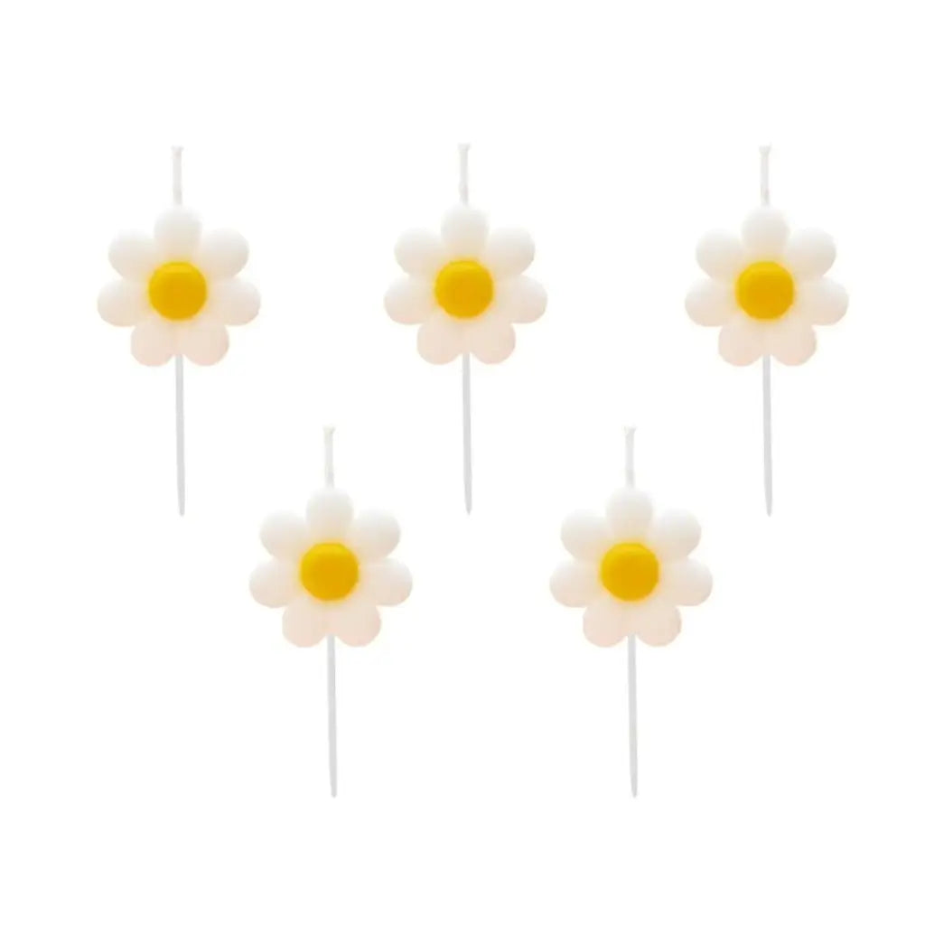 White and yellow daisy flower candles for birthday cake or garden party