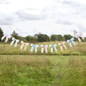 Pastel bow garland for tea parties, bridal showers, and floral birthday decorations