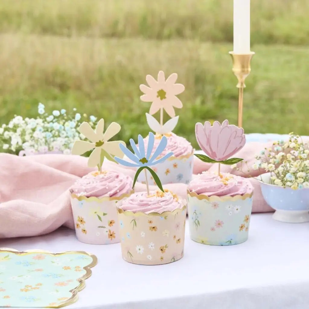 Set of pastel floral food picks and cupcake cups for tea party or garden celebration