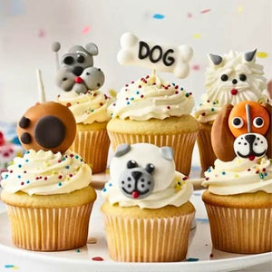 Dog sugar decorations on top of vanilla party cupcakes