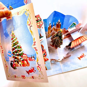Handmade winter wonderland card with ice rink and festive rides