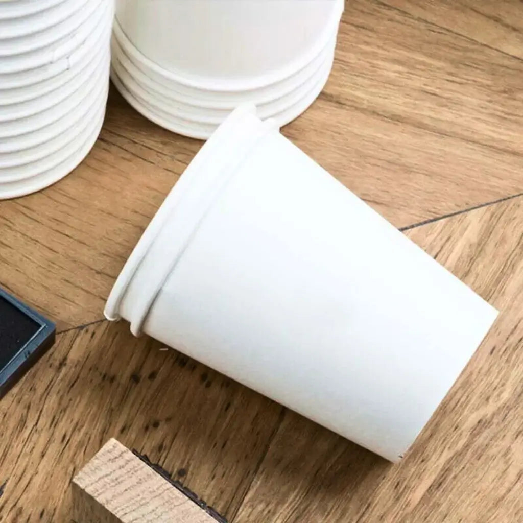 Pack of white compostable paper coffee cups