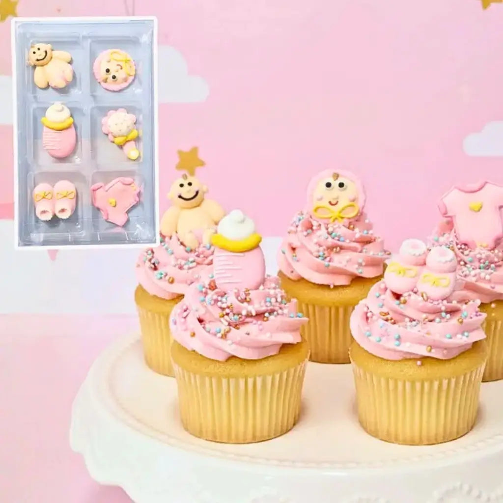 Christening cake decorated with pink sugar toppers