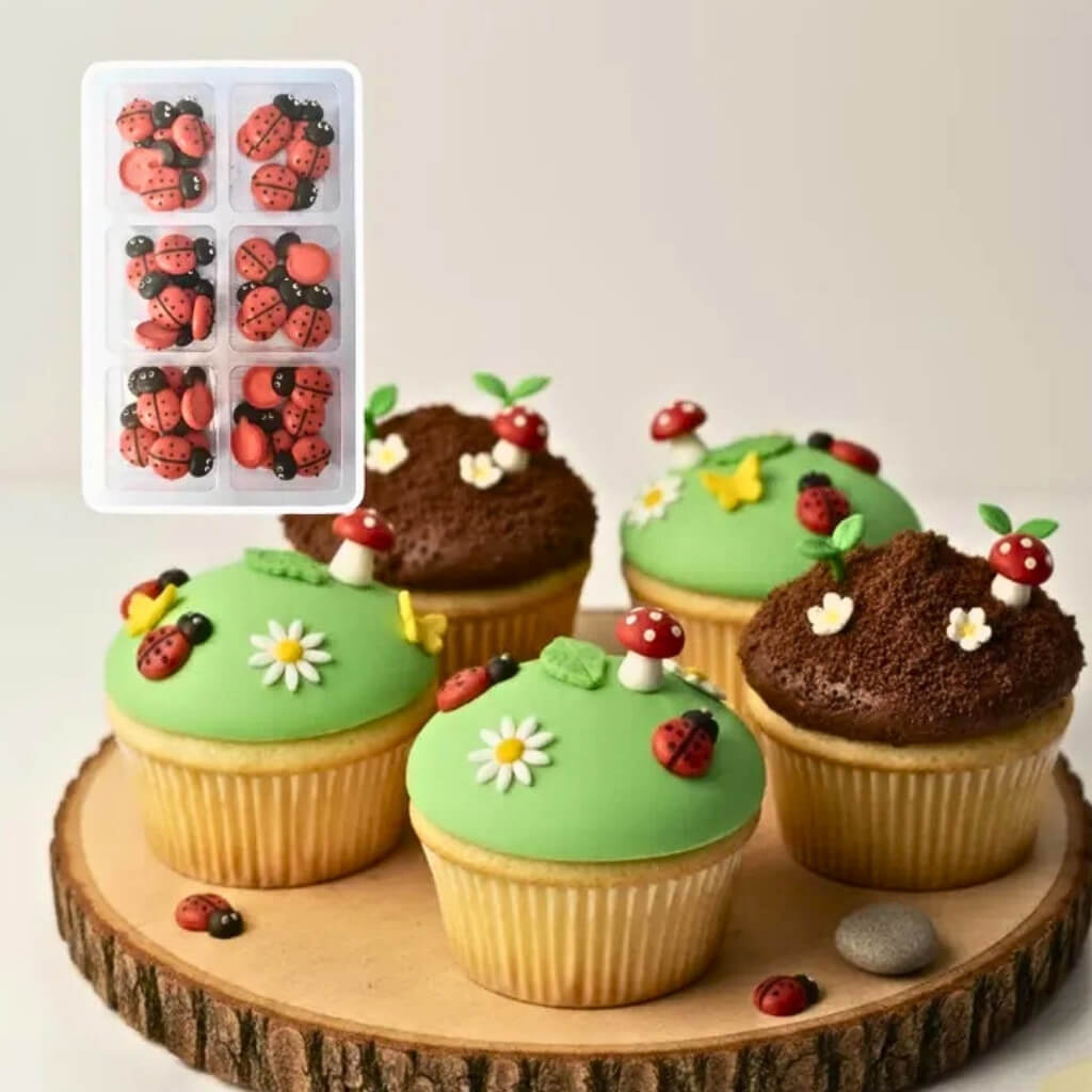 Ladybug sugar cake toppers featuring detailed red and black edible decorations.