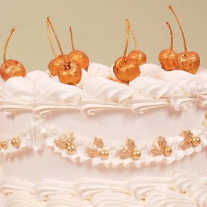 Gold sprinkle bauble for elegant festive cakes and Christmas desserts