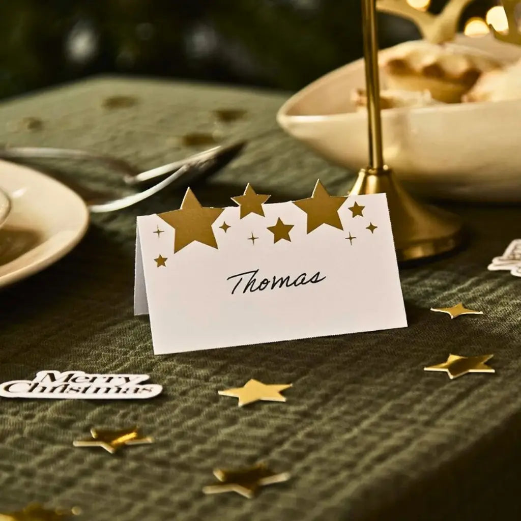 White and gold star Christmas place cards for elegant holiday dinners