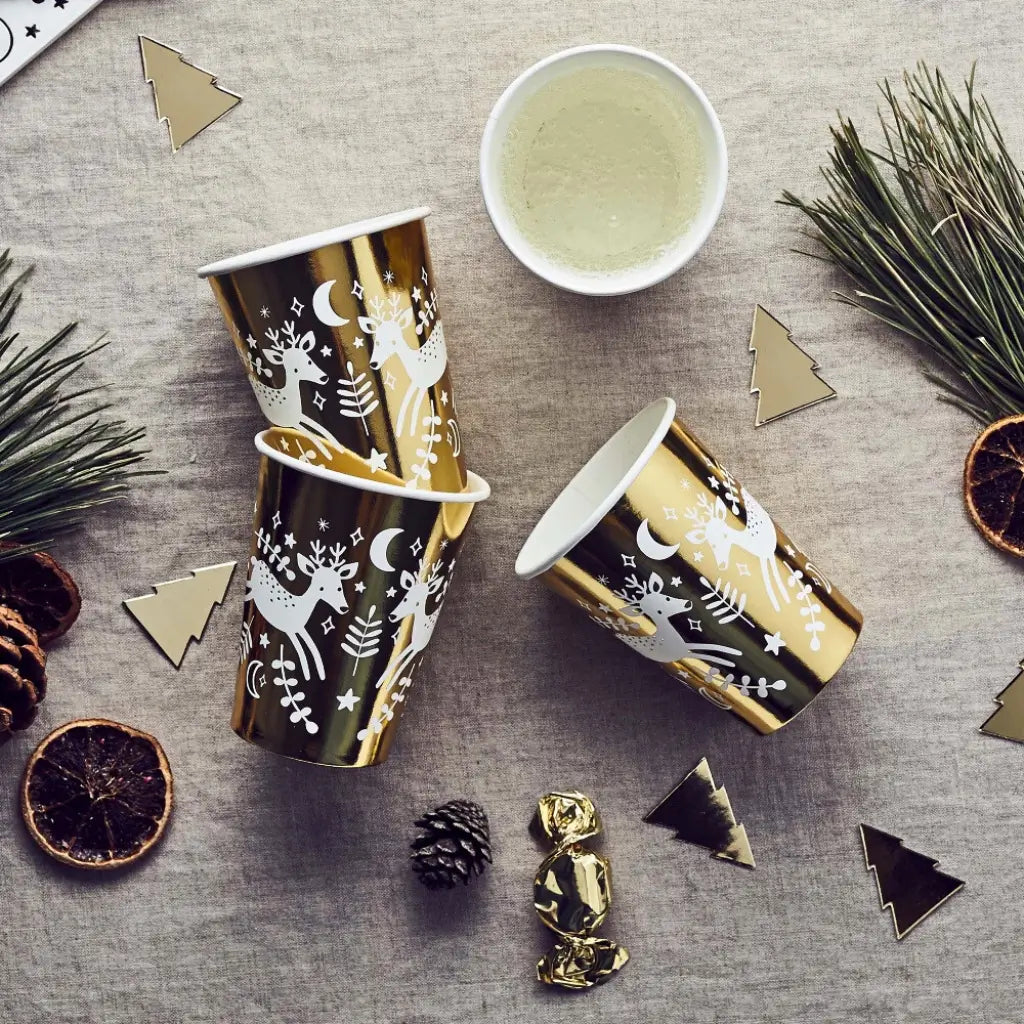 Gold-foiled reindeer Christmas paper cups for holiday parties and dinners