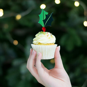 Red and green foil holly and berry cake toppers on wooden sticks for Christmas desserts