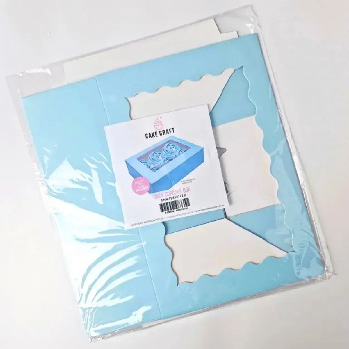 Flat-packed blue packaging box for six standard cupcakes