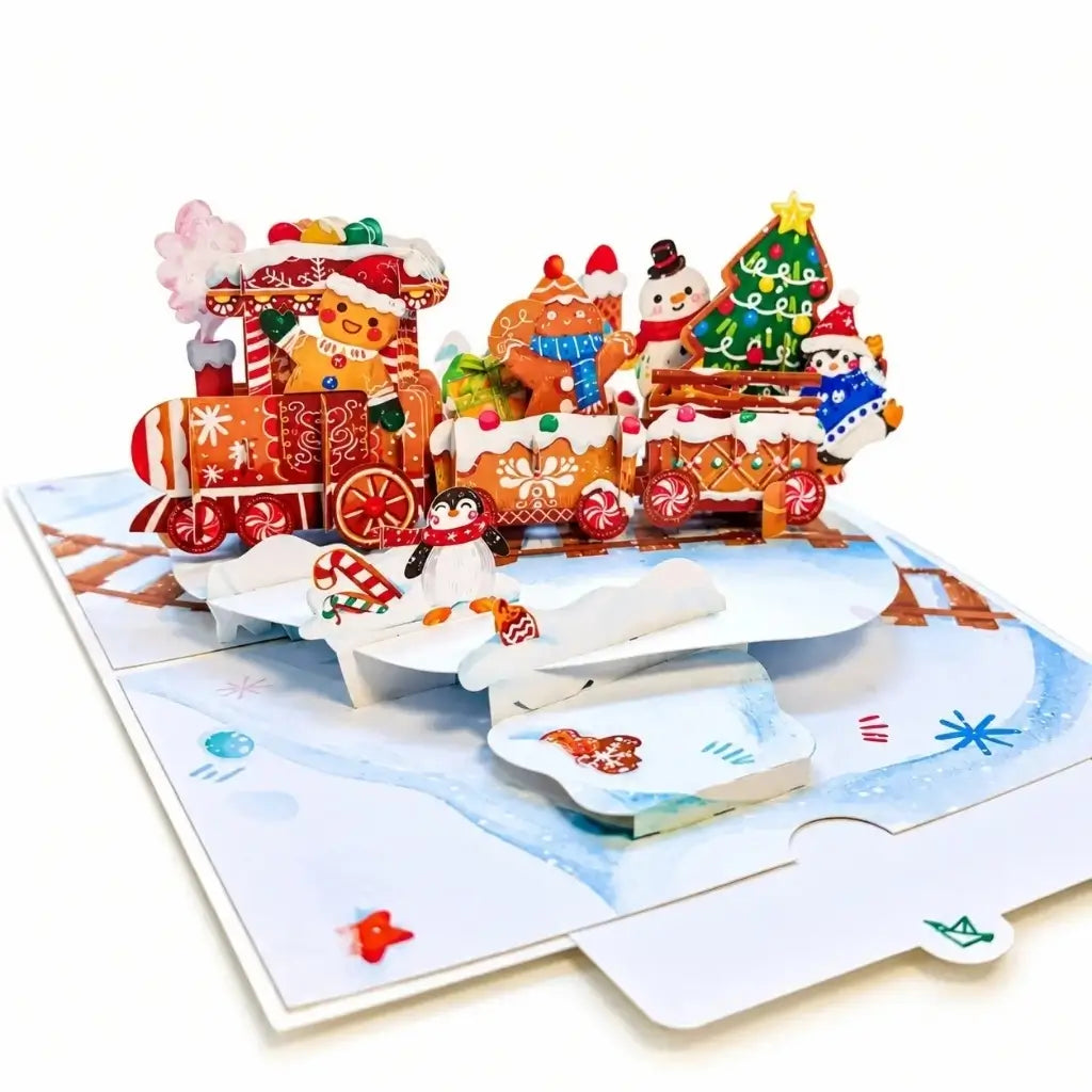 Gingerbread Christmas train 3D pop-up greeting card featuring festive characters and colourful train carriages