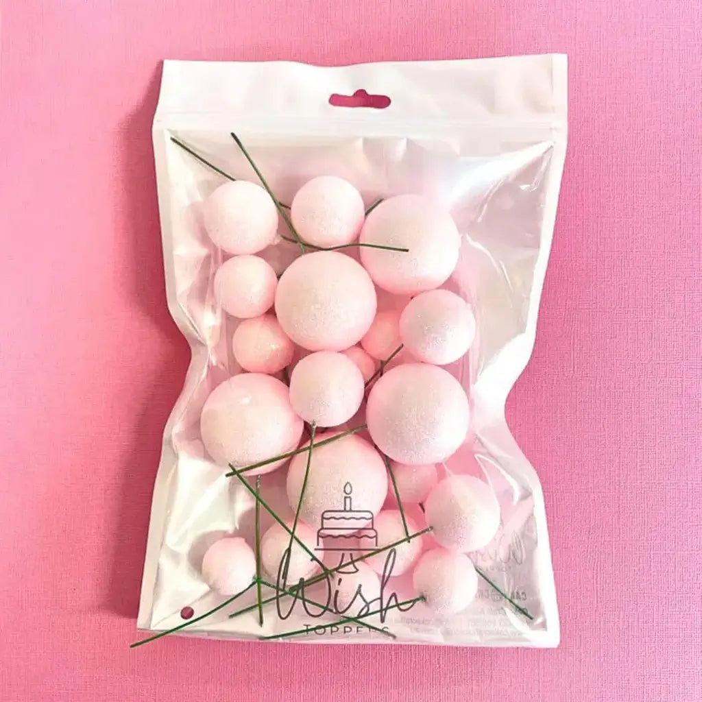 Mixed size baby pink cake decoration spheres