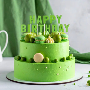 Glow in the dark happy birthday candles on cake