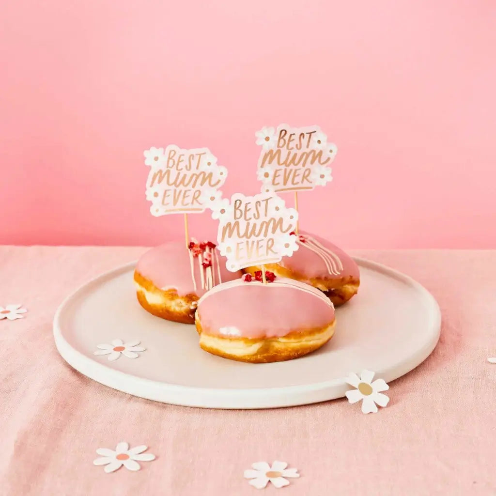 Pink and white daisy food picks for brunch party table styling