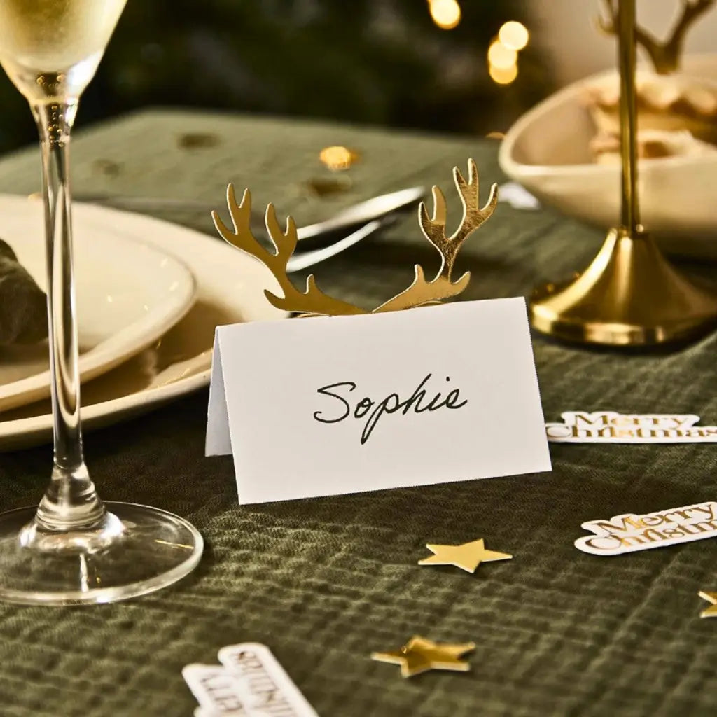 Cosy Christmas white folded place cards with gold foil antler design