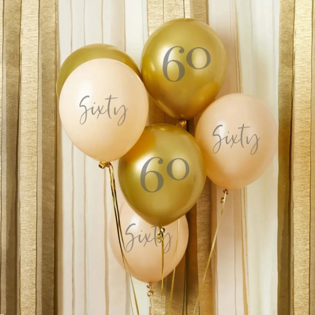 Gold latex party balloons printed with the number 60