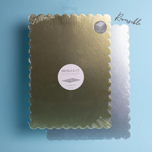 Papyrus rectangular scalloped cake board displayed on the gold side