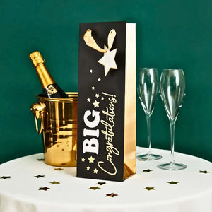 Black and gold bottle gift bag with star tag