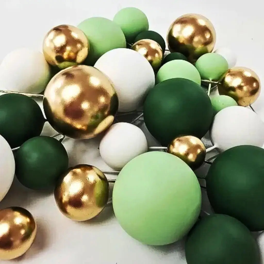 Mixed size foam ball cake decorations on stems