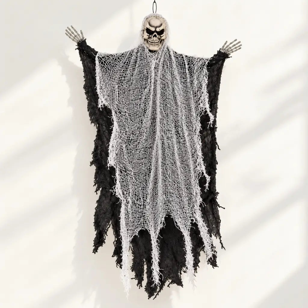 Grim reaper decoration featuring a skull face and raised skeletal hands