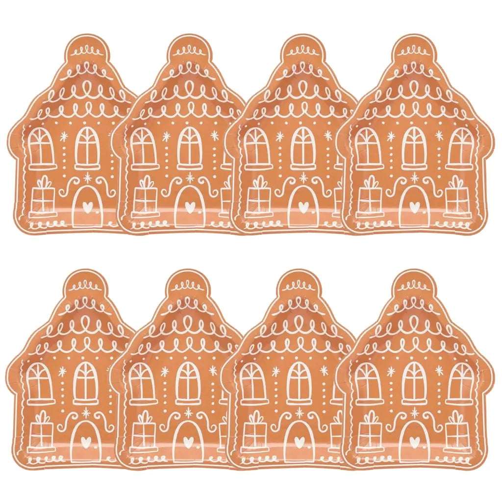 Holiday paper plates shaped like gingerbread houses with festive accents