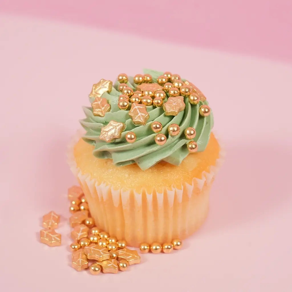 Gold Christmas cake decorations with pearls and holly leaf shapes