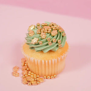 Gold Christmas cake decorations with pearls and holly leaf shapes