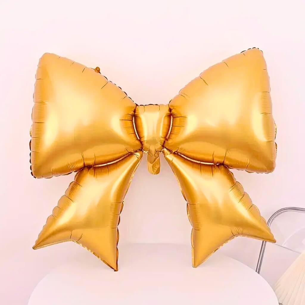 Jumbo Ribbon Bow Knot Foil Balloon in red, white sand, metallic gold, pastel purple, pastel pink & pastel blue