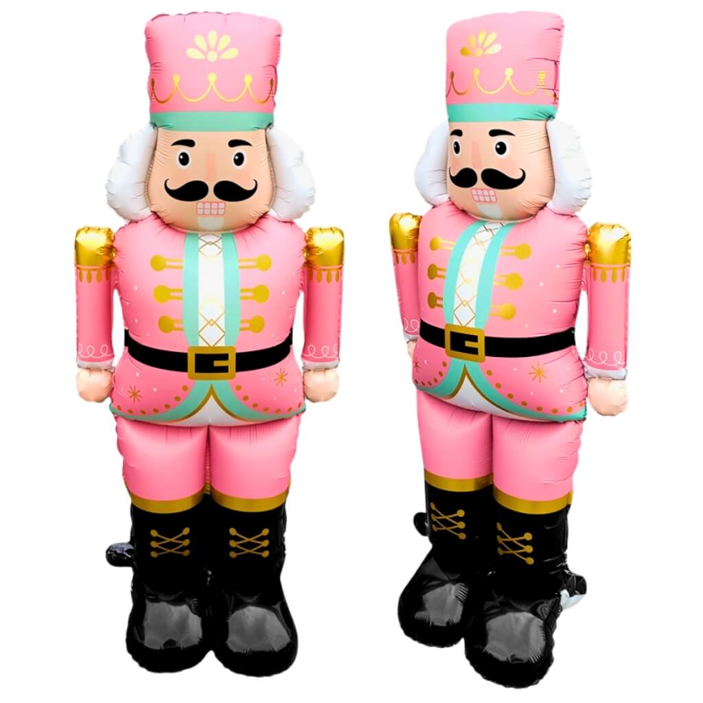 Inflatable nutcracker toy in pink costume on a white background